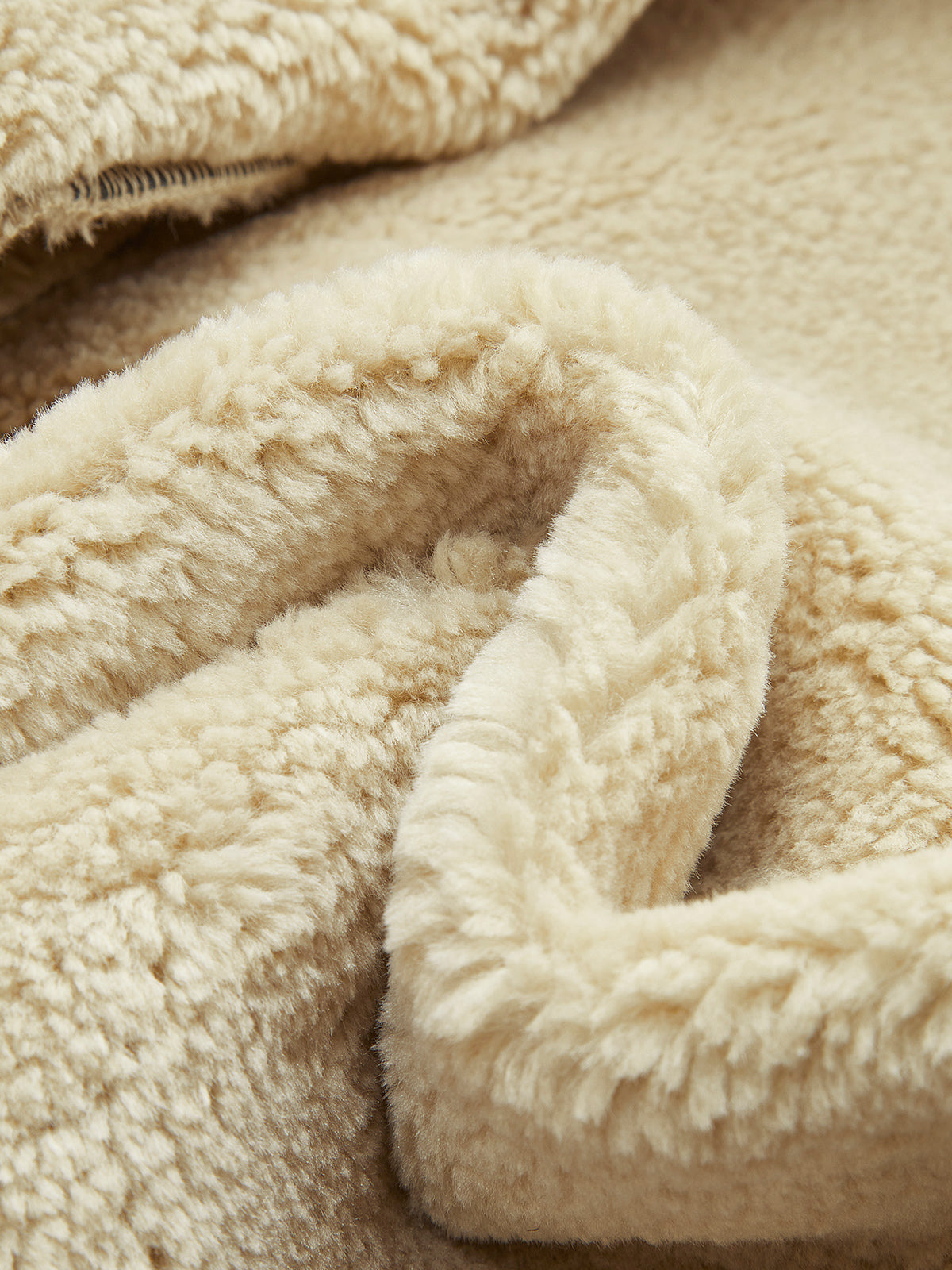 CAPRI | BELTED SHEARLING JACKET