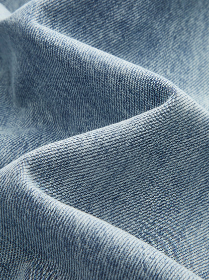 ROMA | ASYMMETRIC WAIST WIDE LEG JEANS LIGHT WASH BLUE