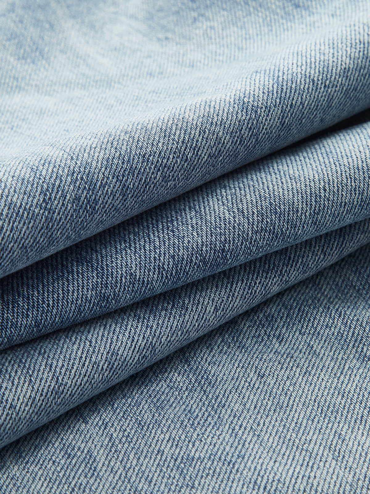 ROMA | ASYMMETRIC WAIST WIDE LEG JEANS LIGHT WASH BLUE