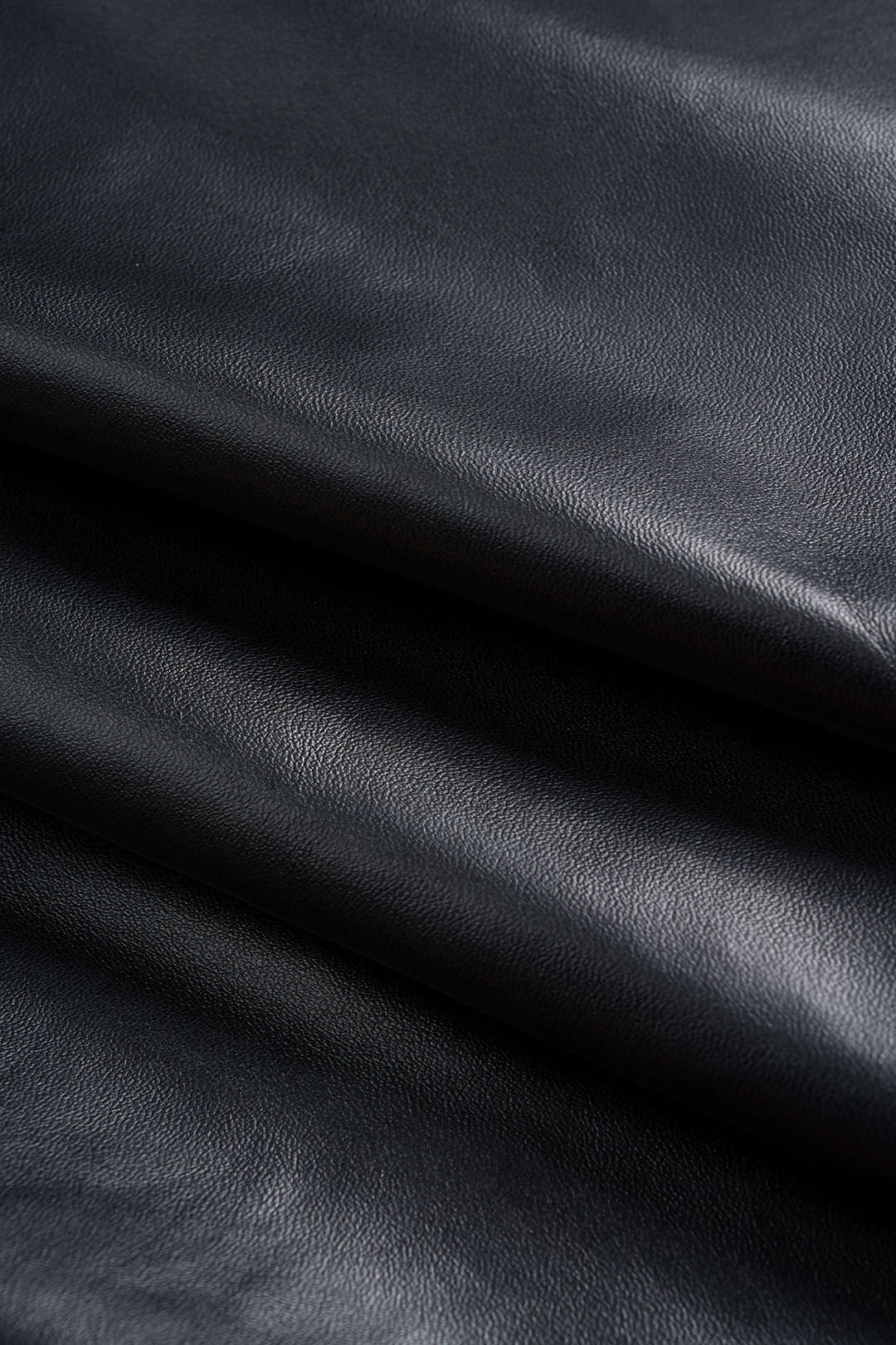 NOIRÉ | DRAPED LEATHER MINI SKIRT